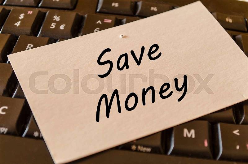 Save money concept on black keyboard background, stock photo