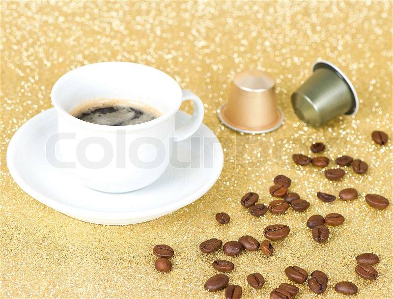 Cup of coffee on golden background, stock photo