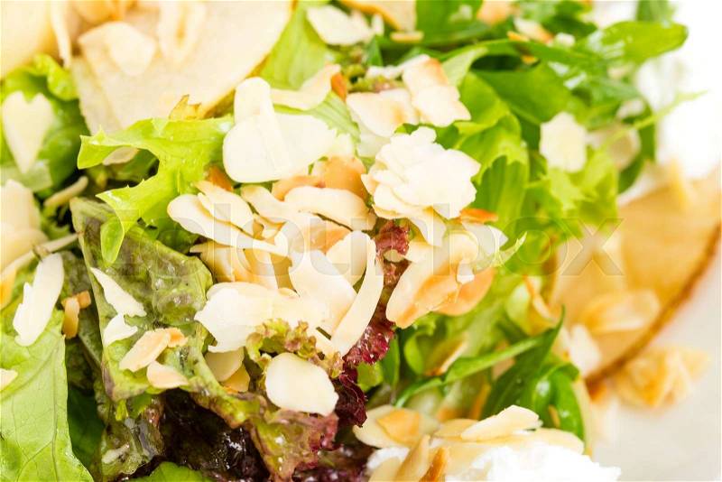 Pear salad with goat cheese and almonds, Macro. Photo can be used as a whole background,, stock photo