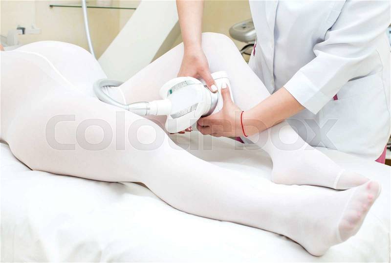 Processes salon doing massage to a pregnant woman, stock photo