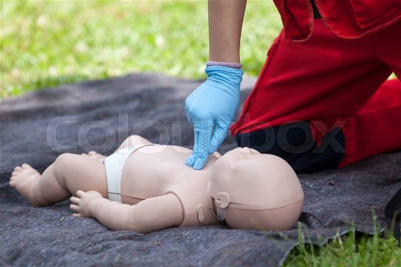 Baby CPR dummy first aid training. Cardiopulmonary resuscitation - CPR. Cardiac massage, stock photo
