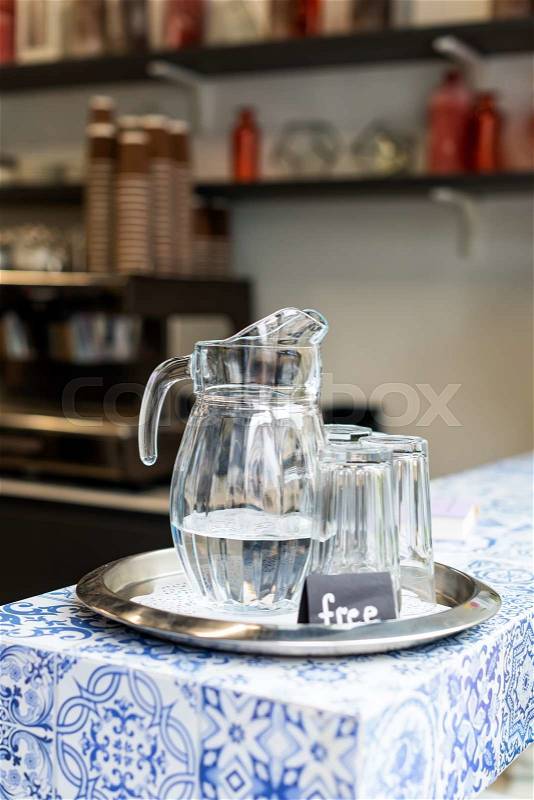 Carafe with free cold water in cafe, stock photo