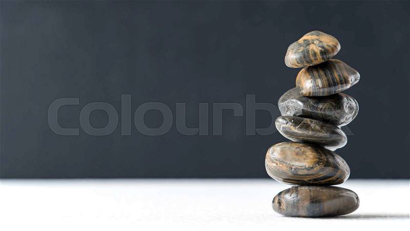 Stone stack on black background, stock photo