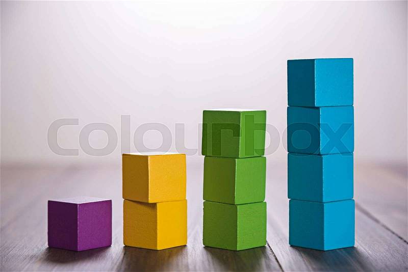 Colorful stack of wood cube building blocks, stock photo