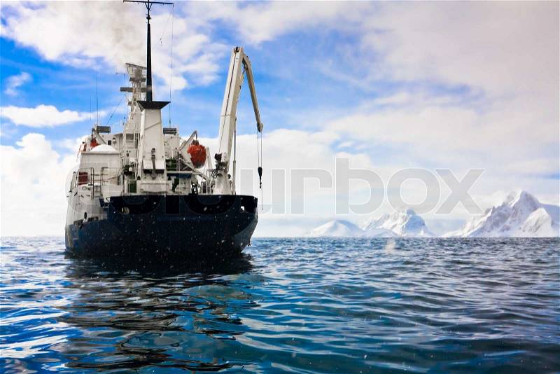Big ship in Antarctic waters, stock photo
