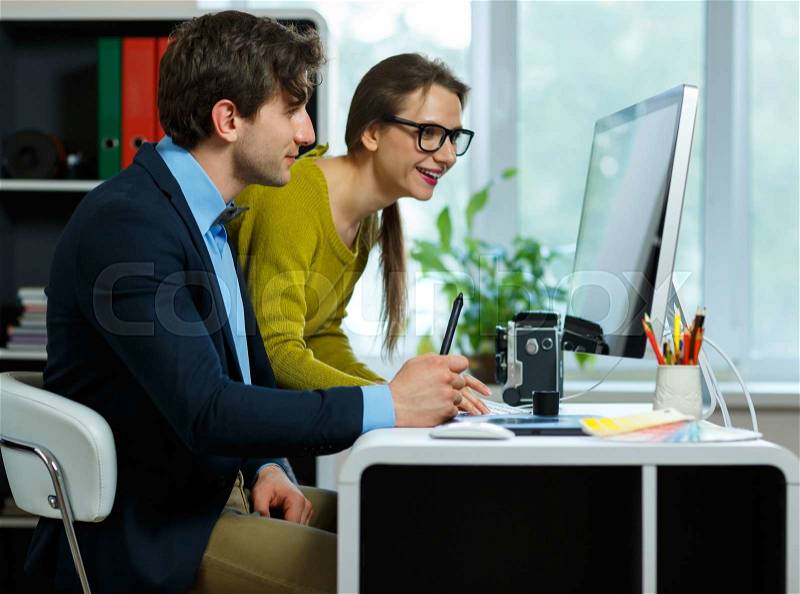 Young colleague - man and woman working from home - modern business concept, stock photo