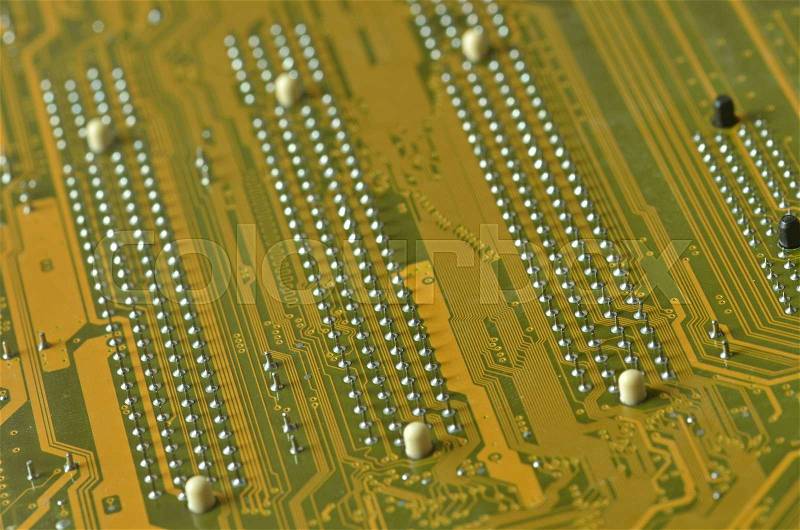 Lines and solder joints of the modern circuit board, stock photo