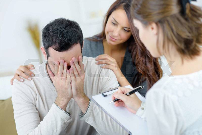 Man being told bad news, stock photo