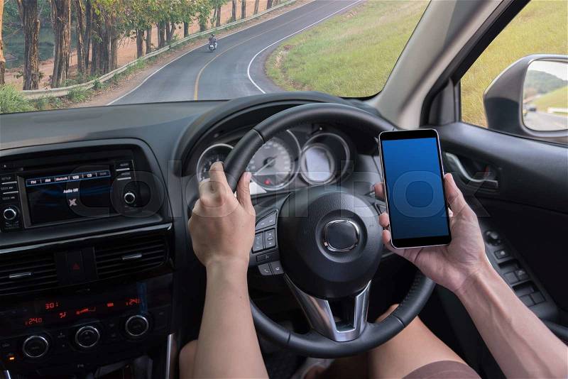 Man driving a car and use mobile tablet for check the map, stock photo