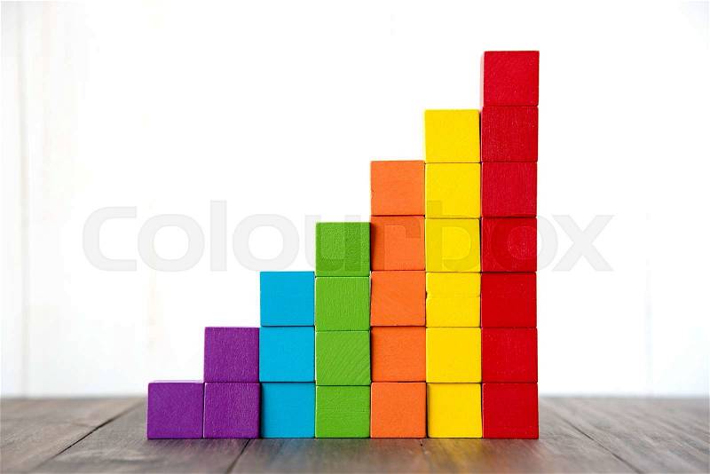 Colorful stack of wood cube building blocks, stock photo