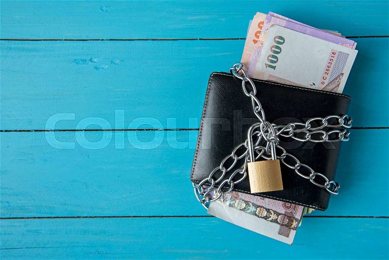 Locked thai money purse with metal chain link with padlock, stock photo