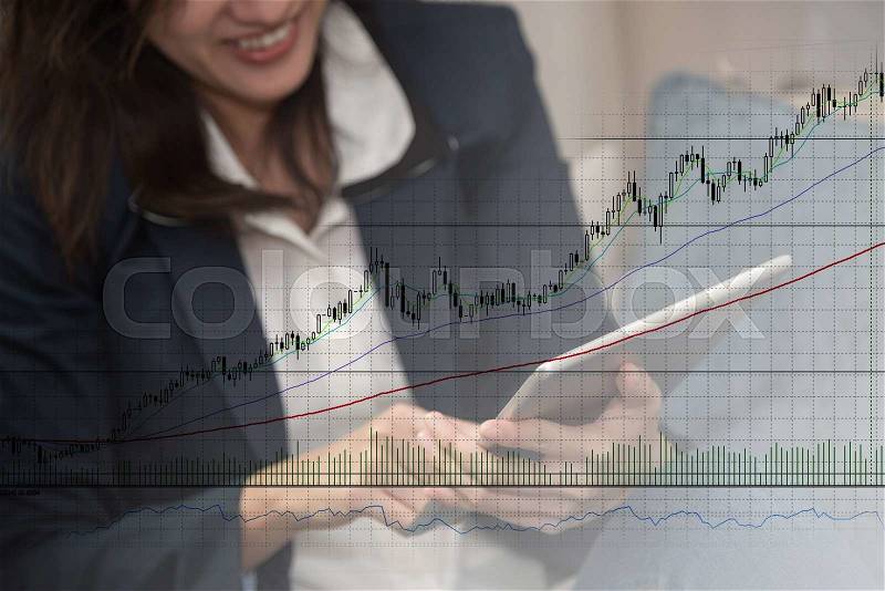 Business woman smiling when using tablet monitor graph on screen, stock photo