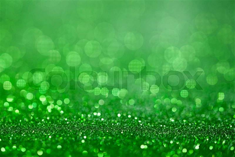 Green glitter surface with green light bokeh - It can be used for background for special occasions promotion campaign or product display, stock photo