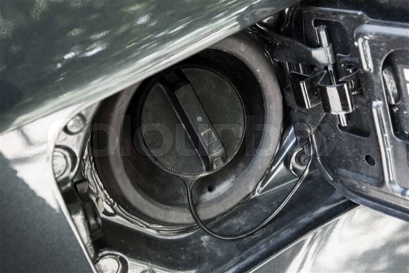 Modern car details, closed fuel cap. Closeup photo with selective focus, stock photo