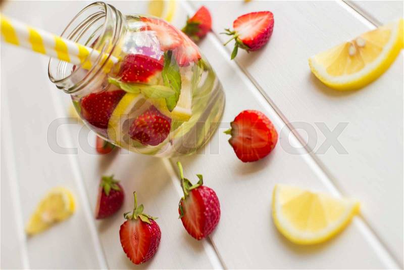 Lemonade with mint and strawberries on a white background, stock photo