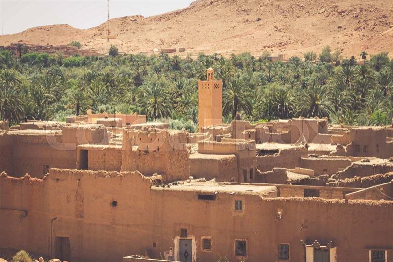 A village at an oasis at the bottom of a canyon in the Atlas mountains, Morocco, stock photo