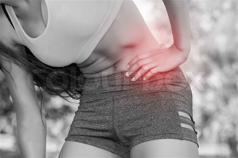 Woman in sport bra having a hip pain / Rheumatoid (In Black and White Tone with Red Mark), stock photo