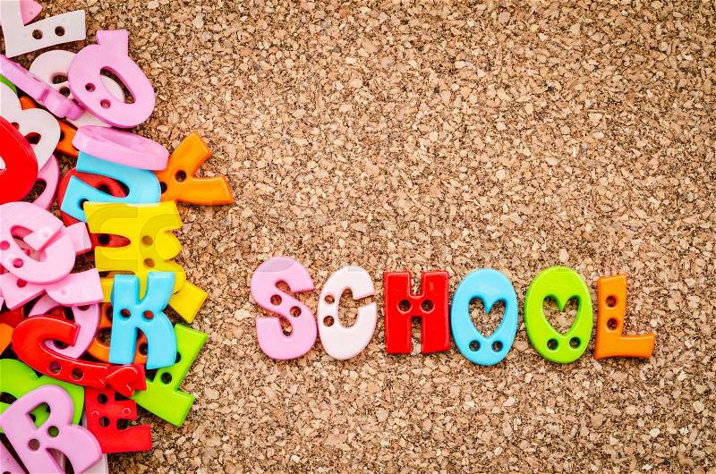 School word of colorful letters on a wooden background, stock photo