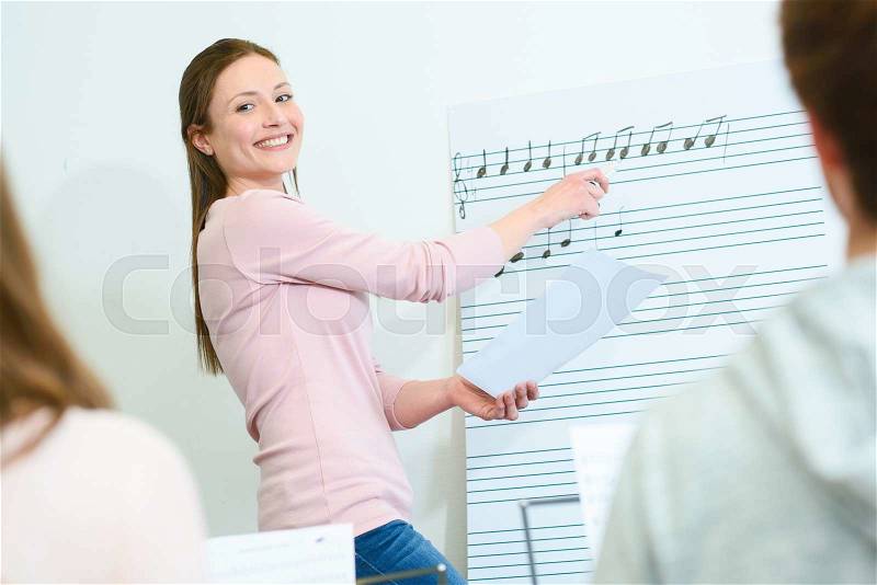 Music teacher at work, stock photo