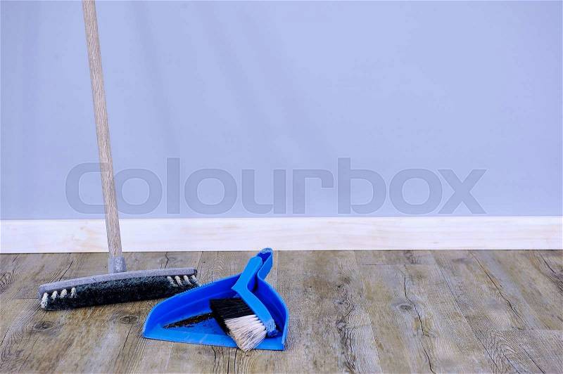 A studio photo of a broom cleaning up, stock photo
