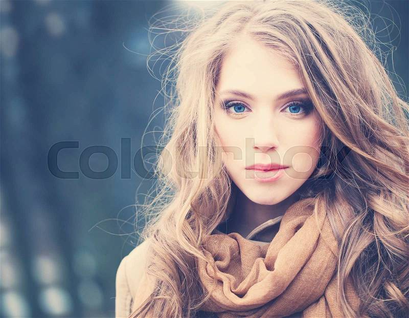 Attractive Woman Outdoors. Windy Hair, Cute Face, stock photo