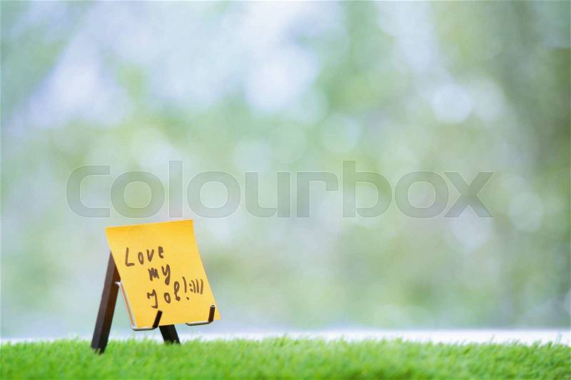 Adhesive note with Love my job text, stock photo