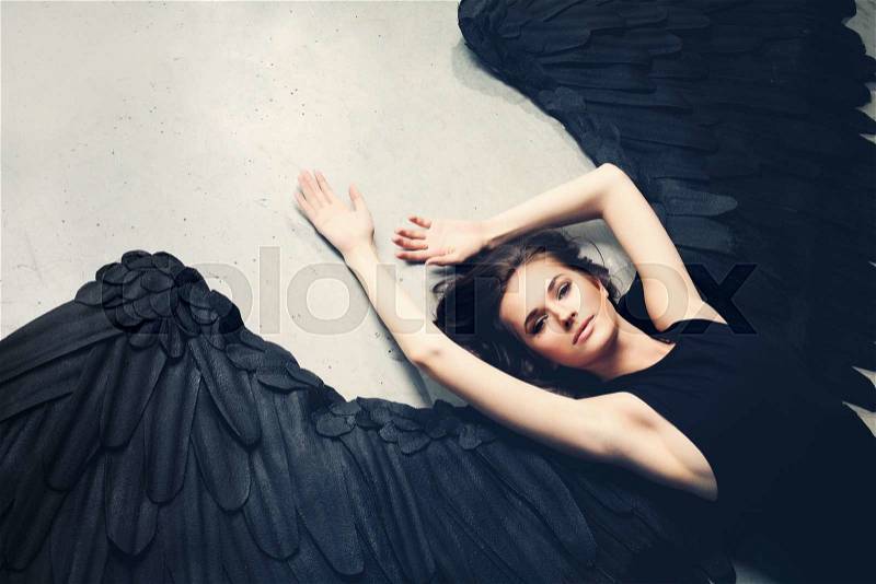 Sensuality Woman Black Angel Relaxing, stock photo