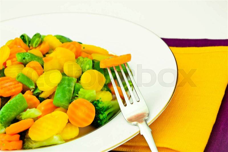 Steamed Vegetables Potatoes, Carrots, Corn, Green Beans and Onion Studio Photo, stock photo