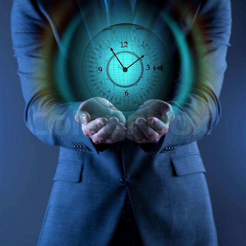 Businessman holding virtual clock in time is money concept, stock photo