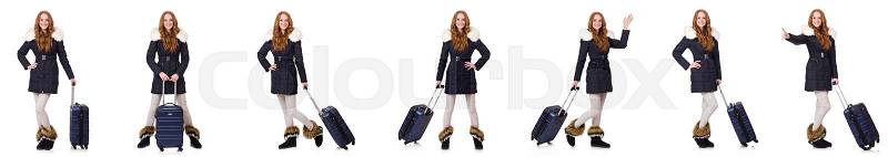 Woman with suitcase preparing for winter vacation, stock photo