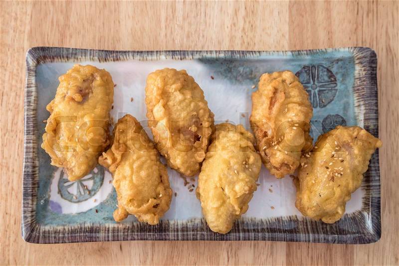 Korean fried chicken with sesame on a plate, stock photo