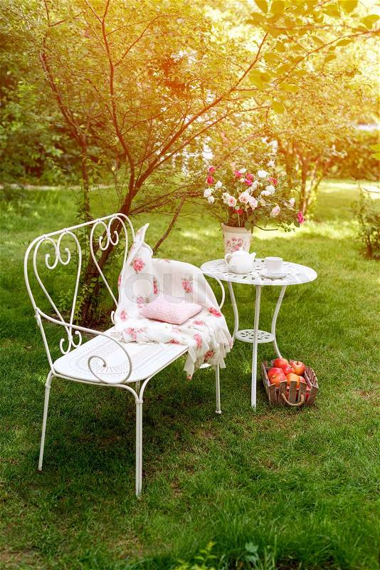 Summer garden with tea party setting. Outdoor party decorations, stock photo