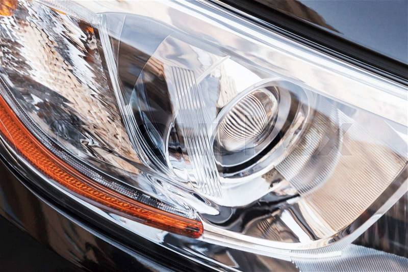 Modern shining car headlight with LED lamps, close up photo with selective focus, stock photo