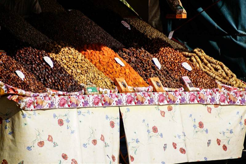 Dried fruits and legumes at a market stall in Morocco, stock photo