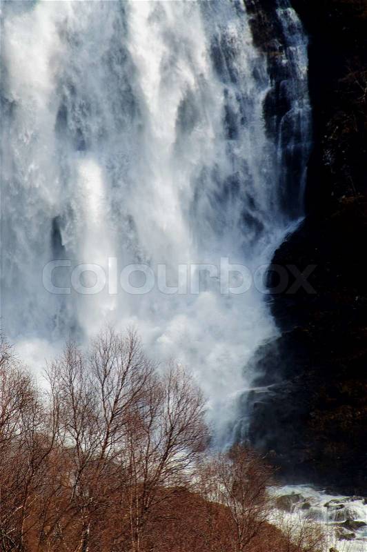 Close up of a large waterfall with a lot of water flow, stock photo