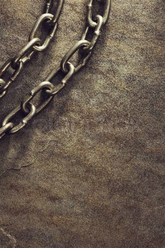 Metal chain at stone background, stock photo