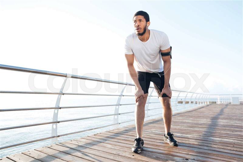 Sportsman is ready to run outdoors in the morning, stock photo