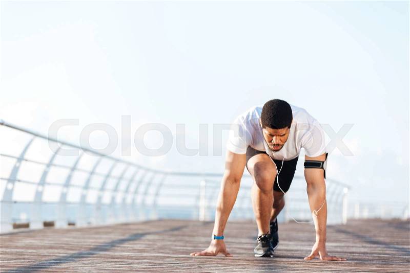 Sportsman is ready to start running outdoors, stock photo