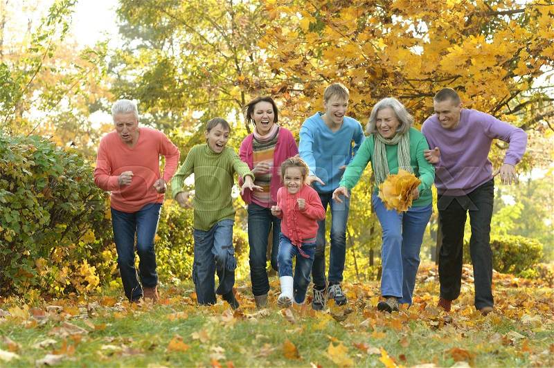 Happy Family resting in a autumn park, stock photo
