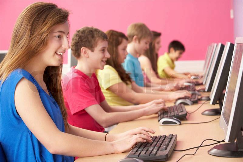 Teenage Students In IT Class Using Computers In Classroom, stock photo