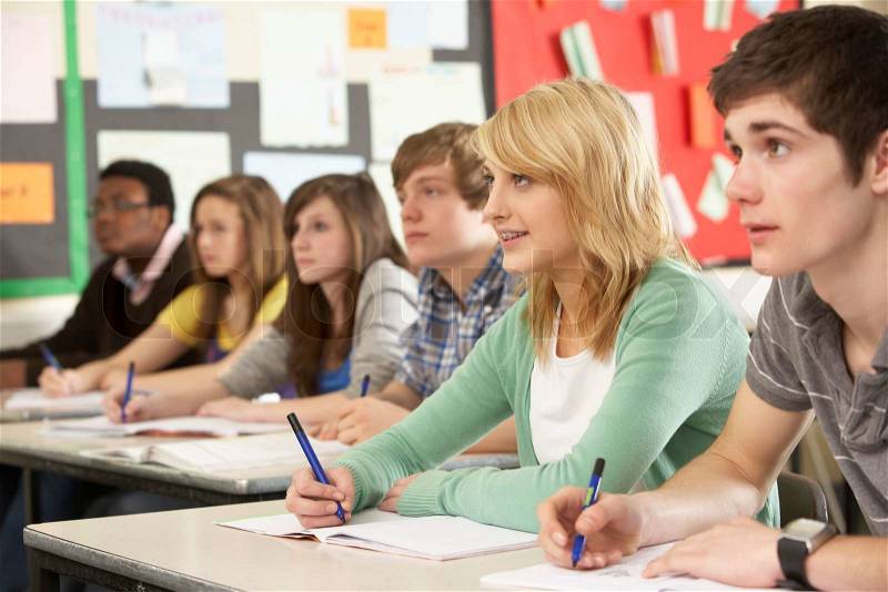 Teenage Students Studying In Classroom, stock photo
