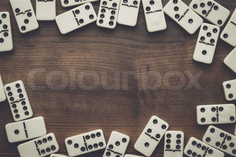 Domino pieces on the wooden table background, stock photo