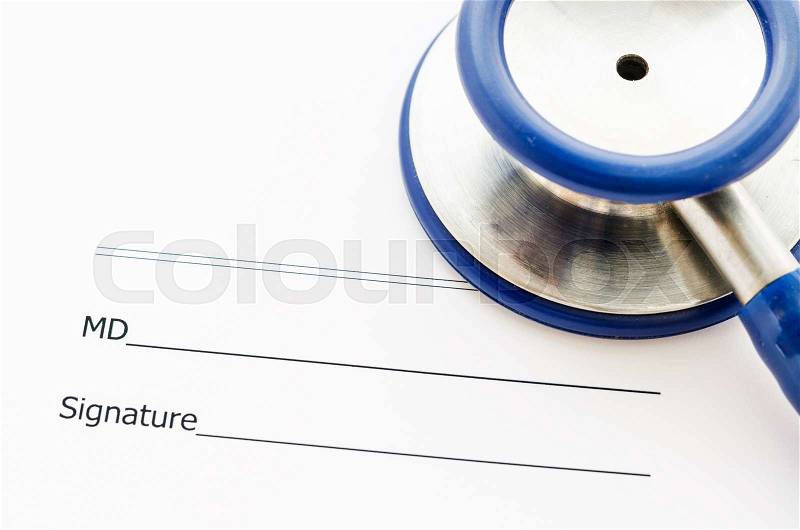 Close up Stethoscope on medical record form focus MD signature, stock photo