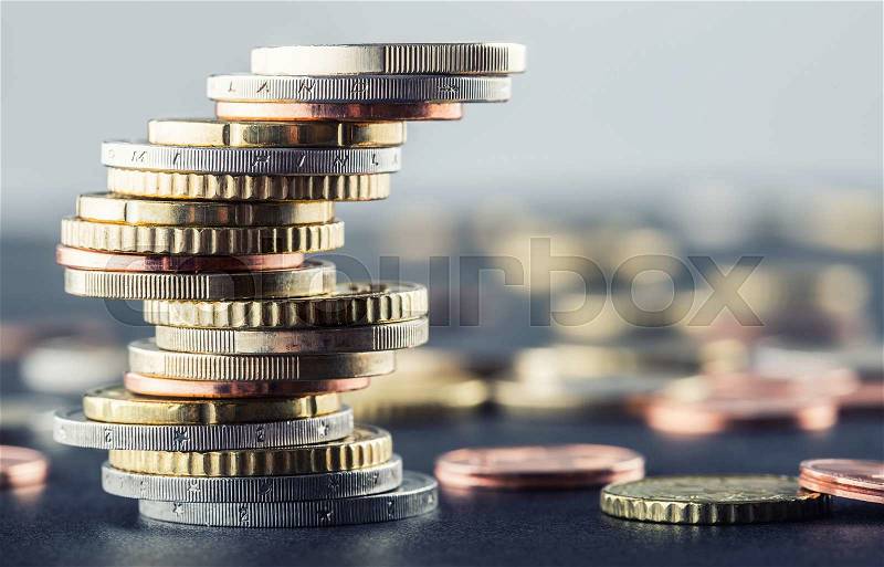 Euro coins. Euro money. Euro currency.Coins stacked on each other in different positions. Money concept, stock photo