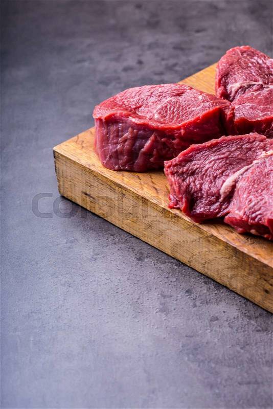 Steak. Raw beef steak. Fresh raw Sirloin beef steak sliced or whole ready for BBQ or grill, stock photo