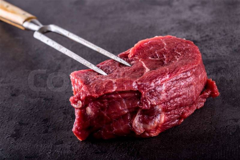 Steak. Raw beef steak. Fresh raw Sirloin beef steak sliced or whole ready for BBQ or grill, stock photo