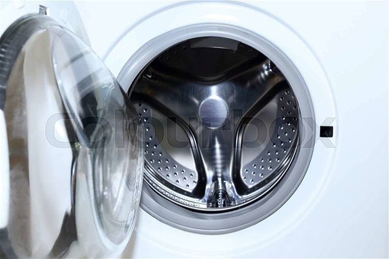 White washing machine for housework clothes cleaning, stock photo