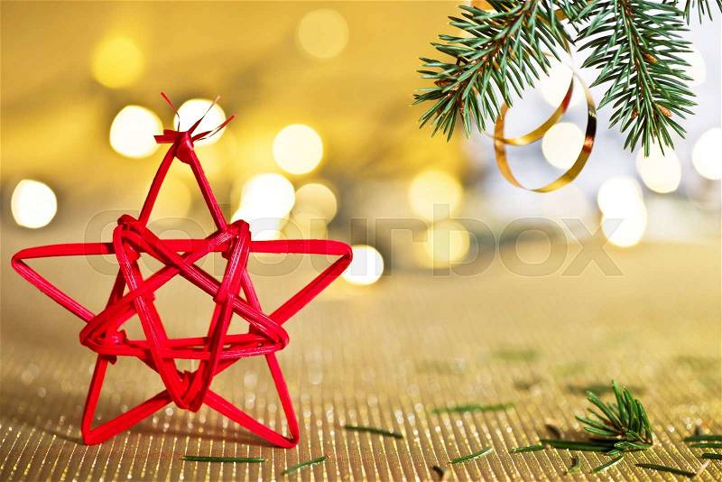 Red Christmas star with needles of Christmas tree, stock photo