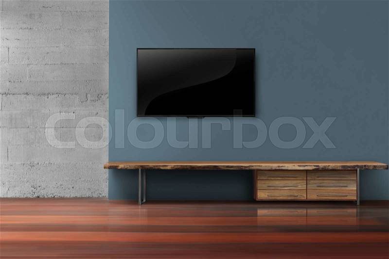 Led tvs on dark blue wall with media furniture in empty living room modern loft style, stock photo