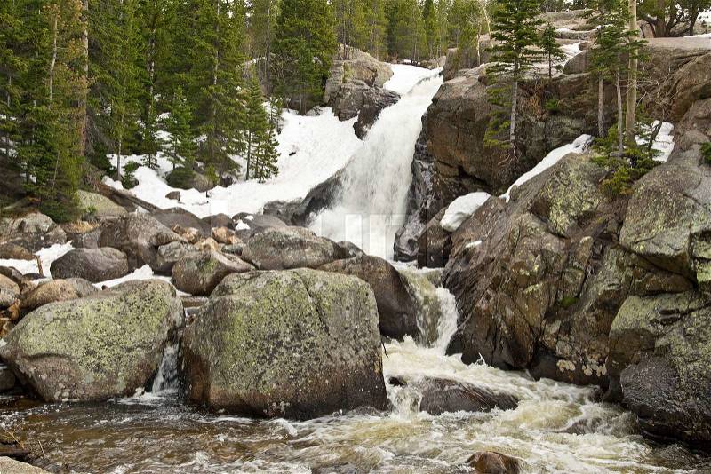 Waterfall in Rocky Mountains in Colorado in springtime, stock photo